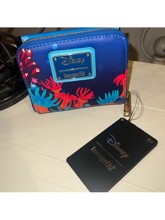 Loungefly Handbags - Loungefly NWT Pinocchio Coral Zip Wallet with Bright Coral Accents